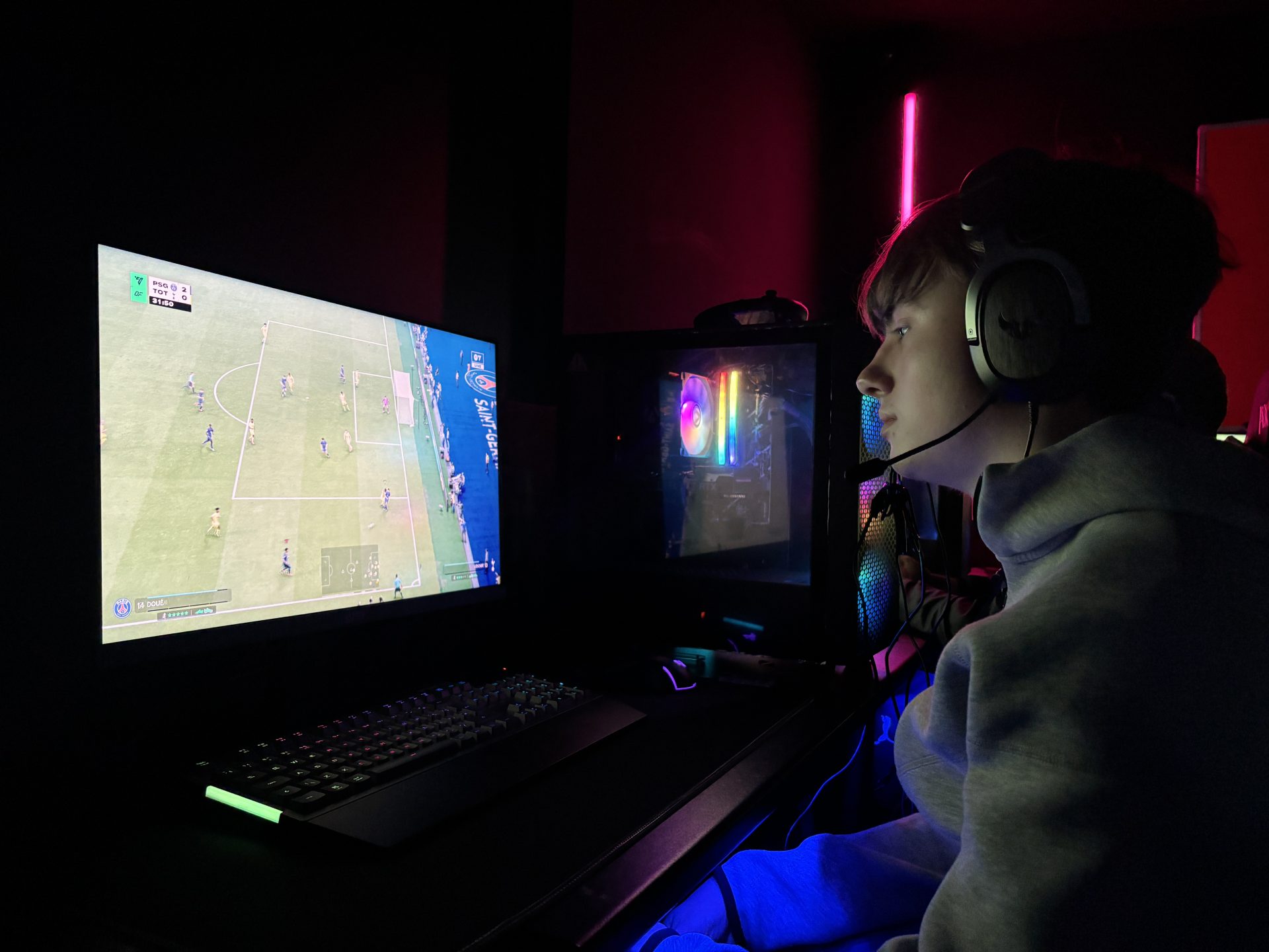 esports players competing on PCs during an online multiplayer match